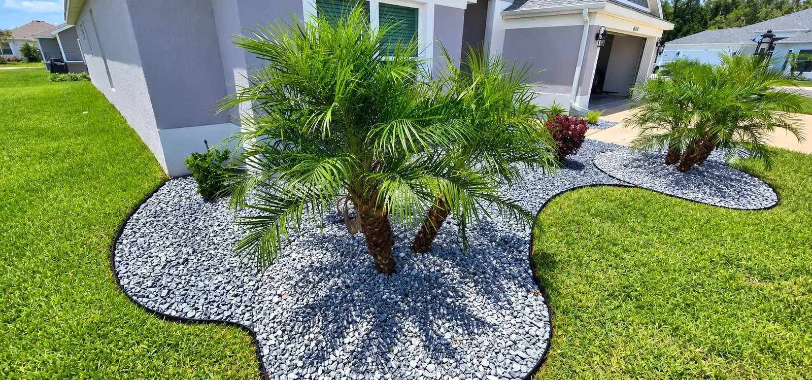 Palm-lined suburban street with manicured lawns in The Villages, Florida